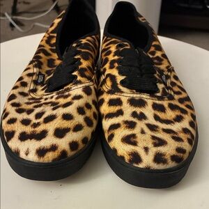 Vans Leopard-Pattern Slip-On Sneakers in Black and Gold